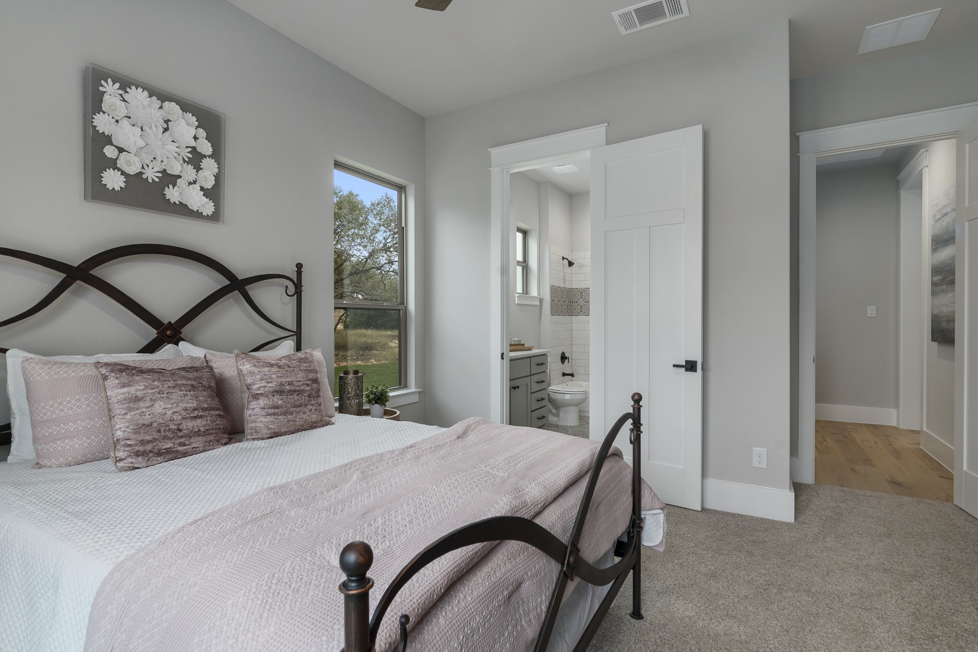 A side view of the Belle Oaks bedroom suite with bathroom within the Belle Oaks custom floor plan from JLP Builders