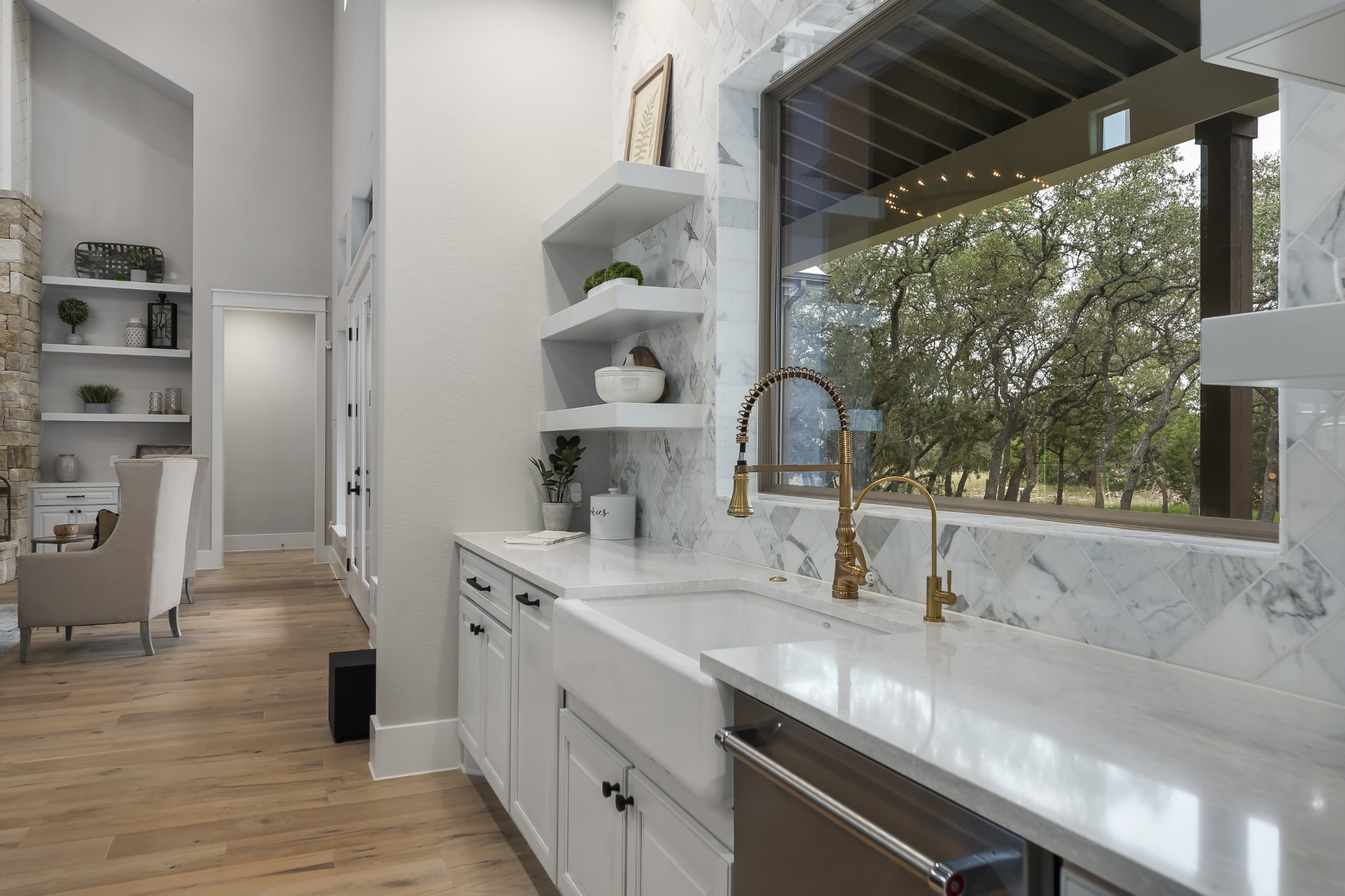 A side view of the kitchen areas sink and window within the Belle Oaks custom floor plan from JLP Builders