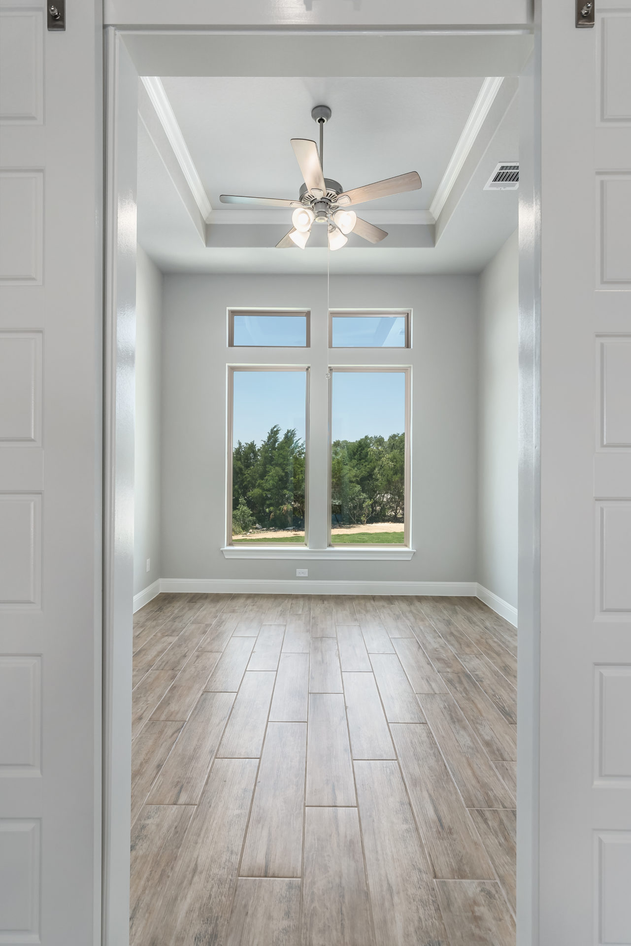 Birch-Front_Room_with_Hard_Floors_through_Door_Frame